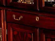 Close-up of the brass pulls on the drawer